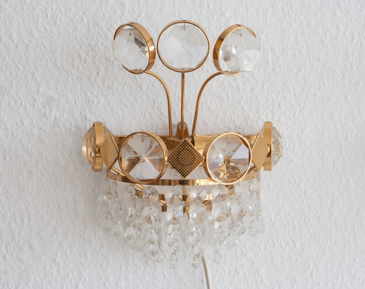A Pair of Gold-Plated Brass Wall Sconces with Cut Crystal Prisms Mollaris.com