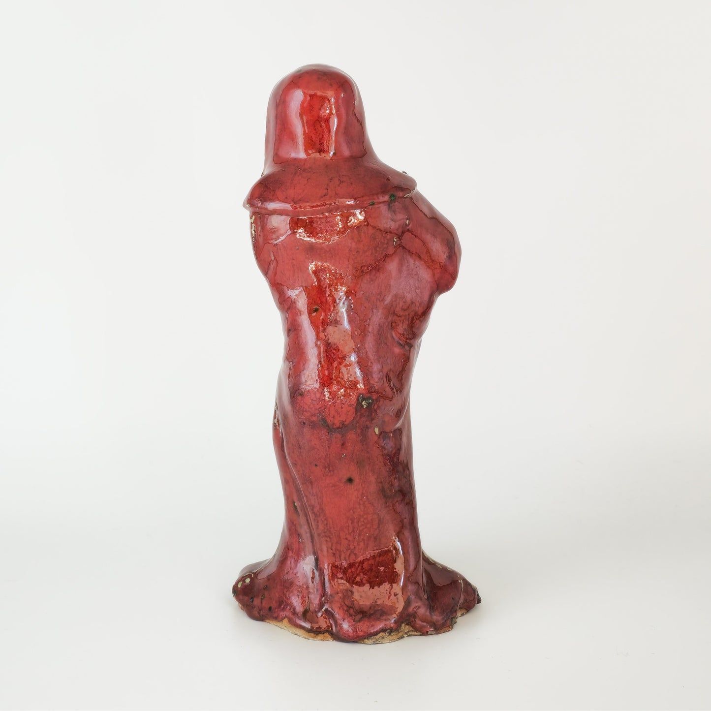 A CHINESE SHIWAN WARE SANG-DE-BOEUF STONEWARE FIGURE OF A LUOHAN | 19TH CENTURY