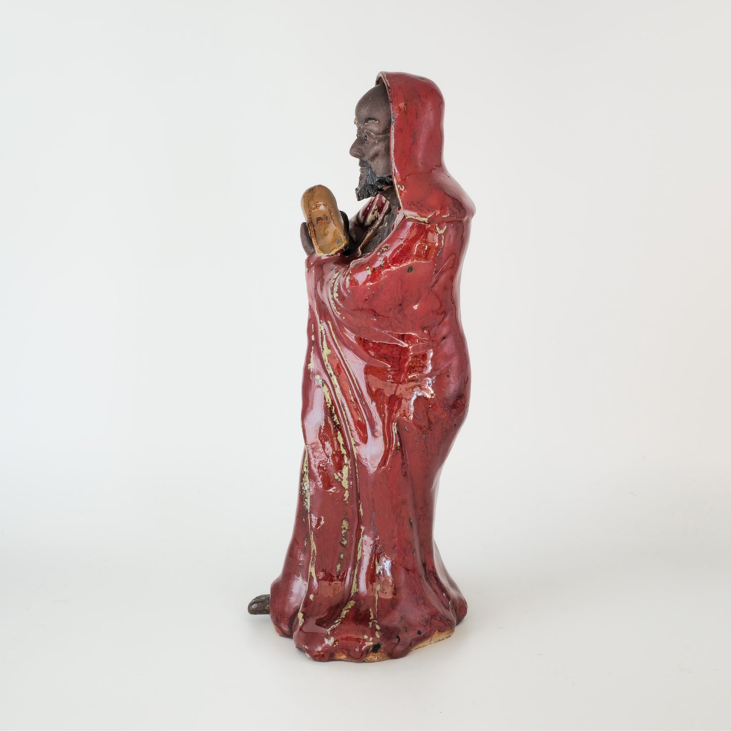 A CHINESE SHIWAN WARE SANG-DE-BOEUF STONEWARE FIGURE OF A LUOHAN | 19TH CENTURY