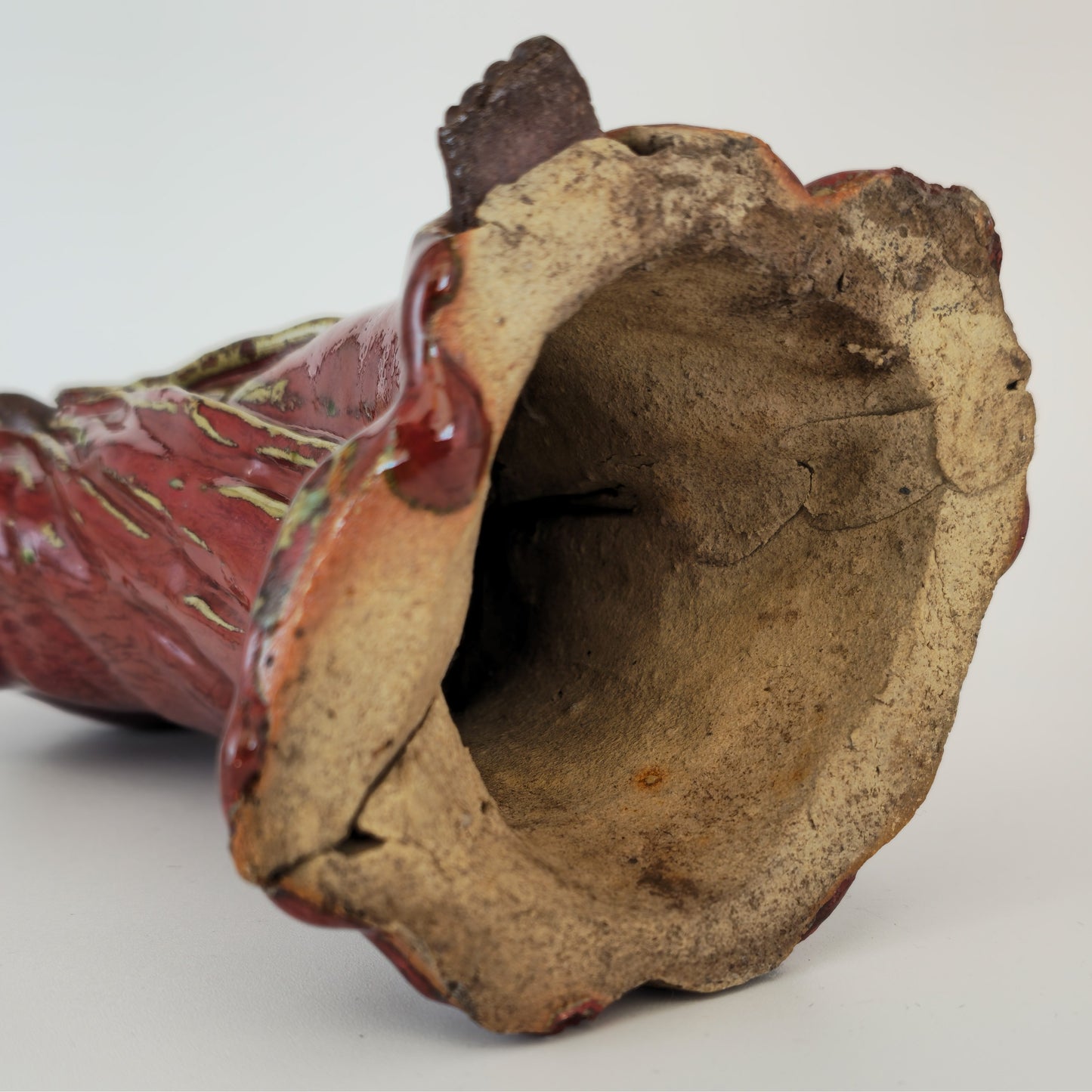 A CHINESE SHIWAN WARE SANG-DE-BOEUF STONEWARE FIGURE OF A LUOHAN | 19TH CENTURY